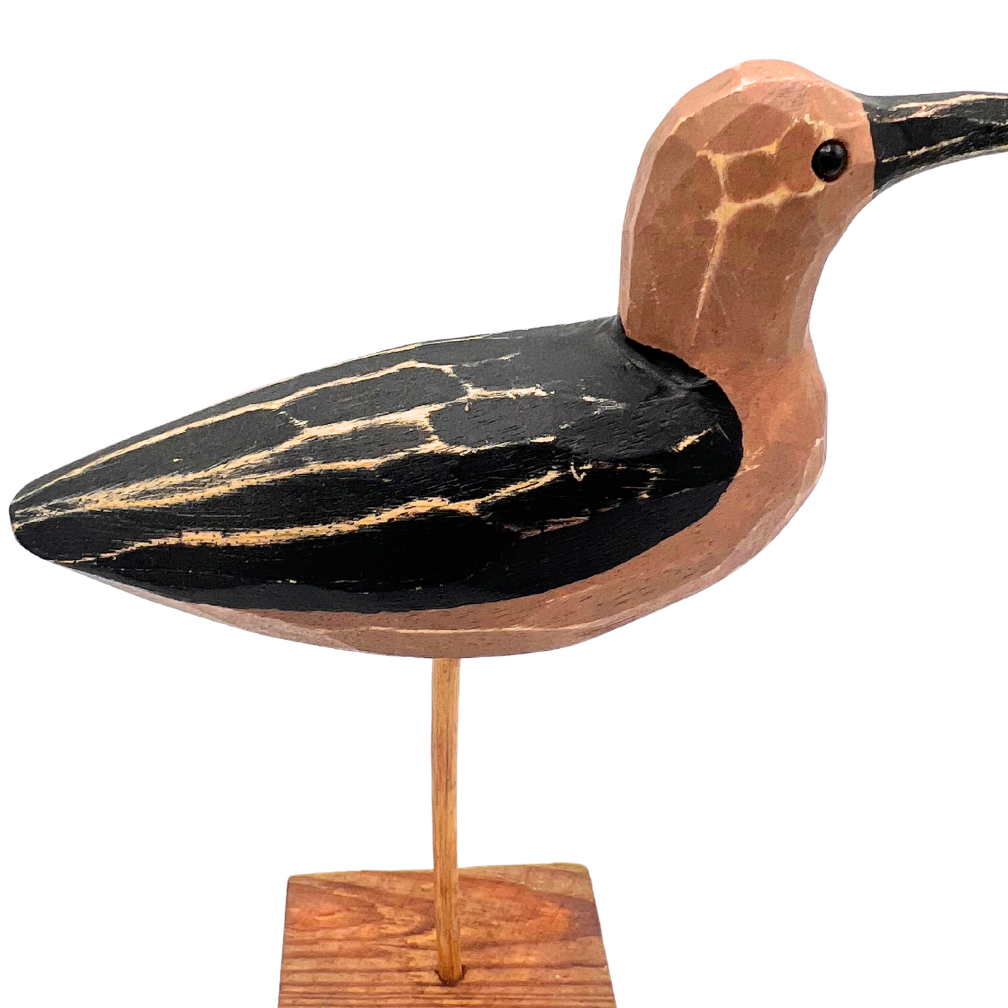 carved wooden shorebird
