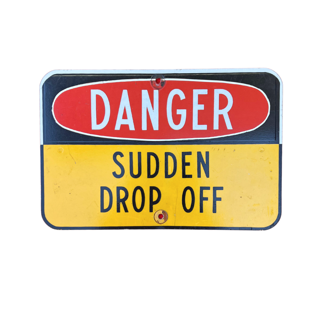 sudden drop off road sign