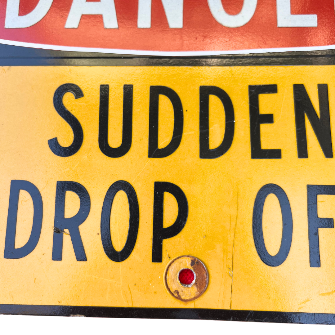 sudden drop off road sign