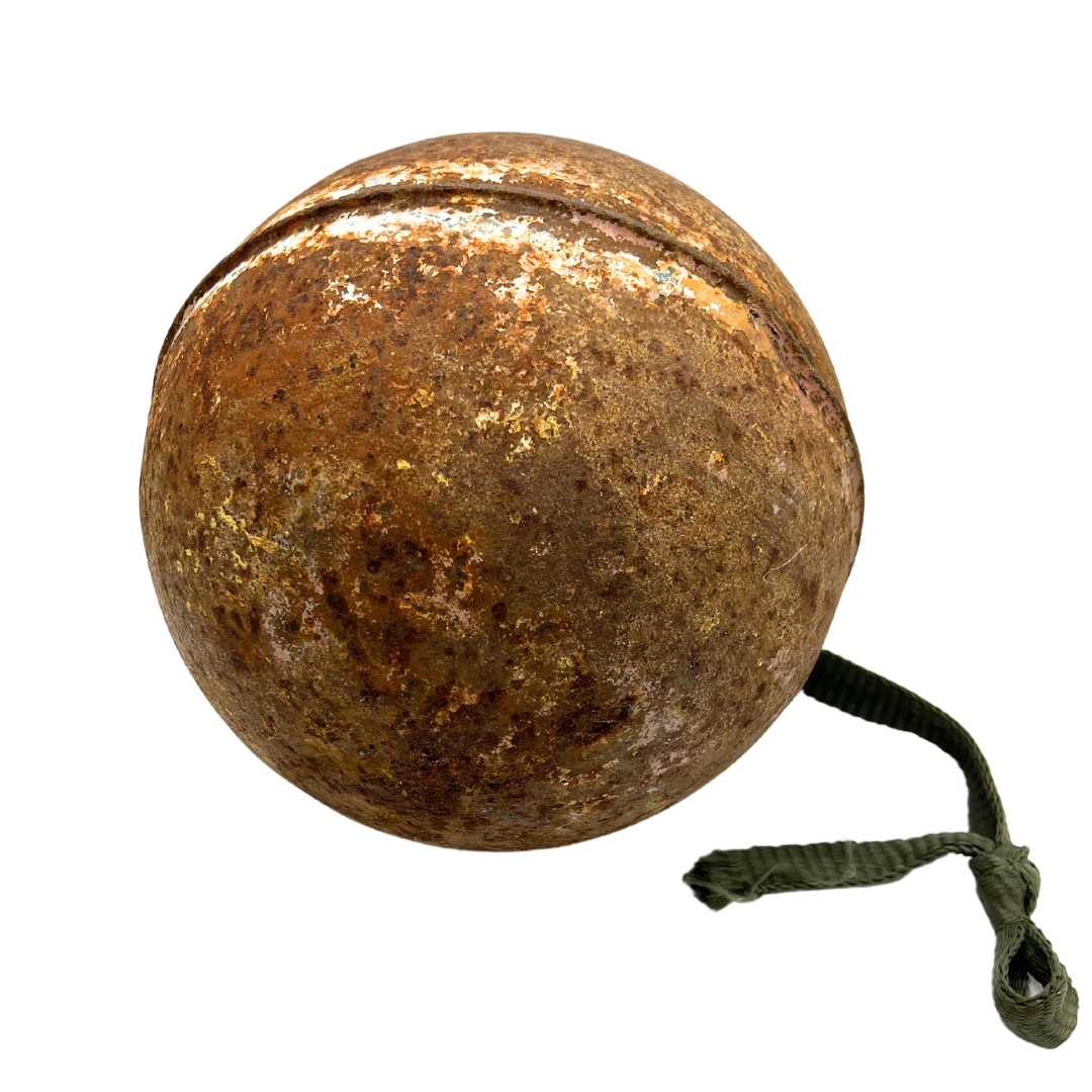 weathered metal fishing buoy