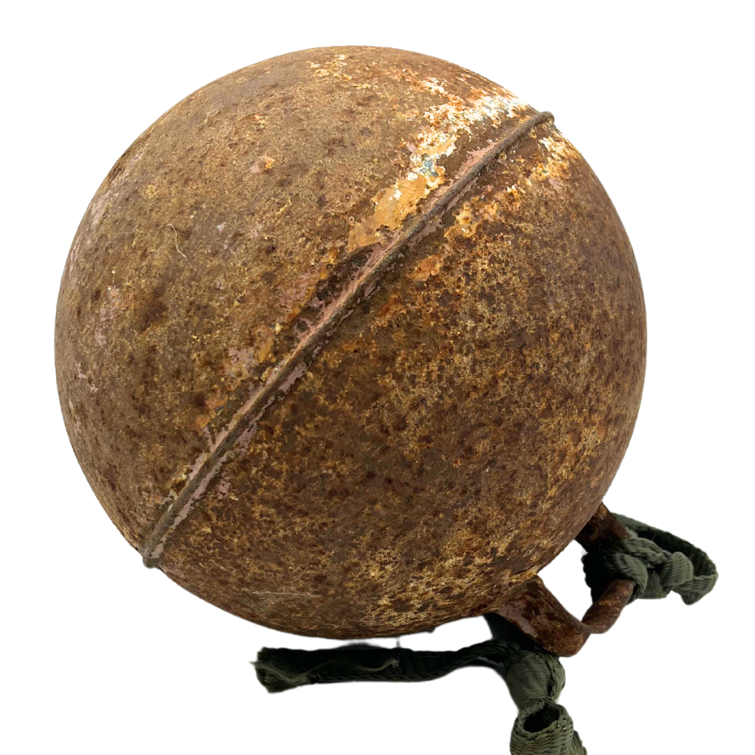 weathered metal fishing buoy