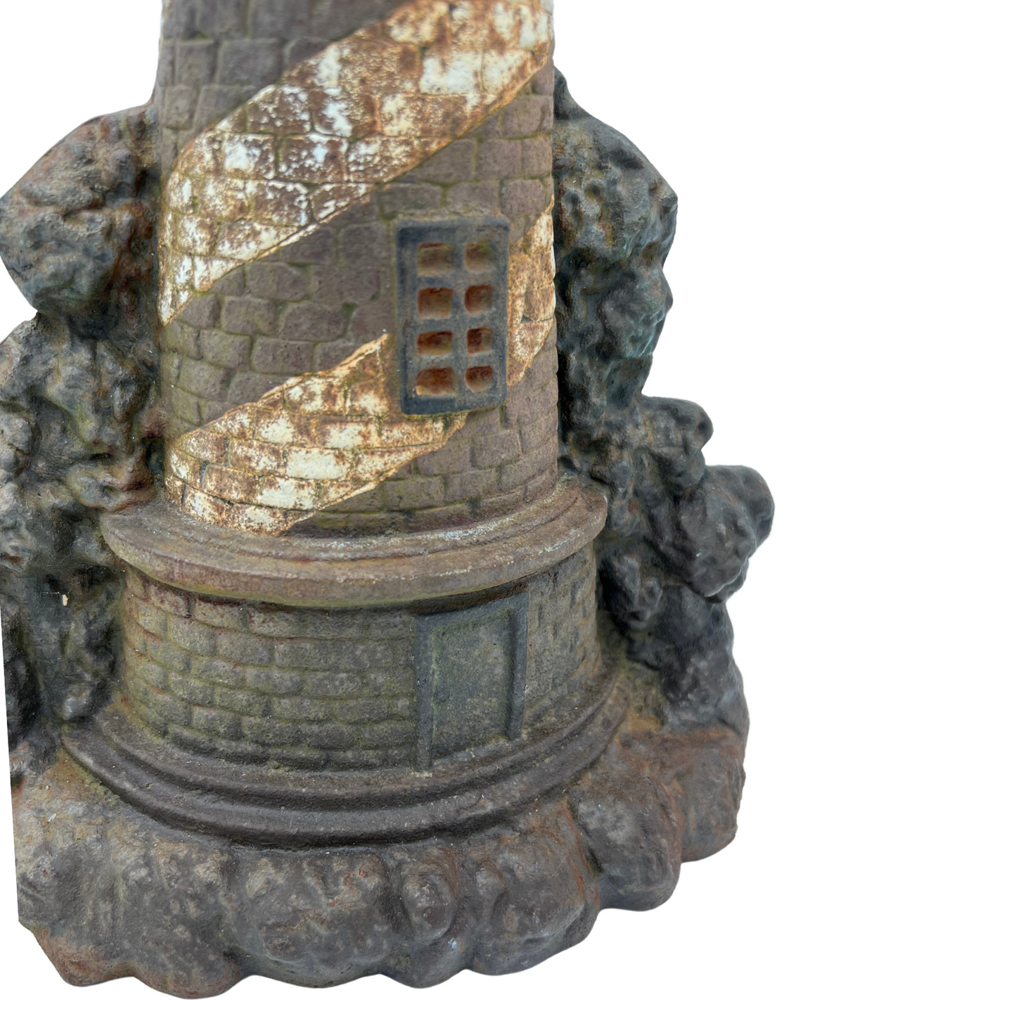 weathered cast iron lighthouse doorstop