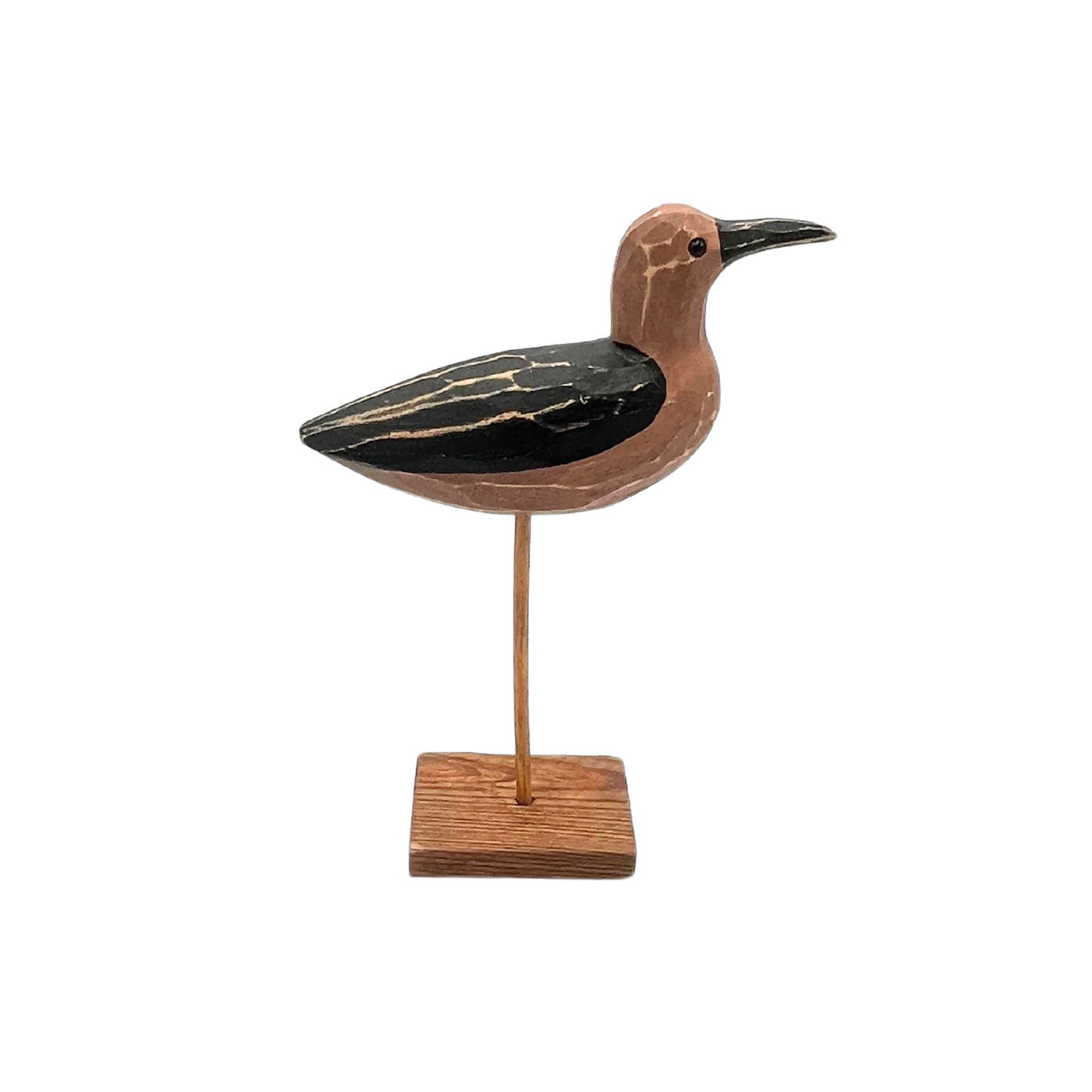 carved wooden shorebird