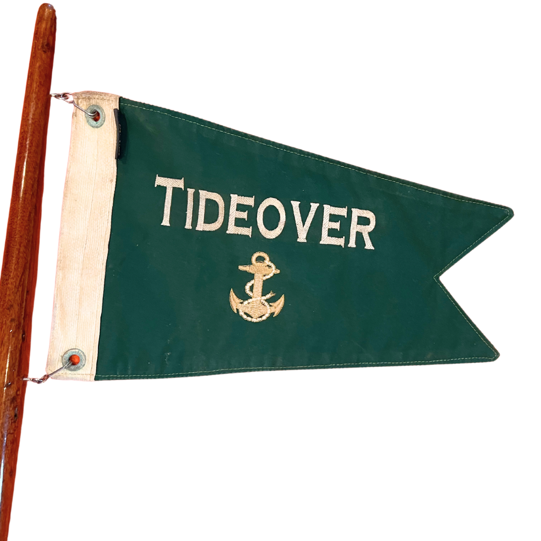 salvaged yacht flag on teak pole