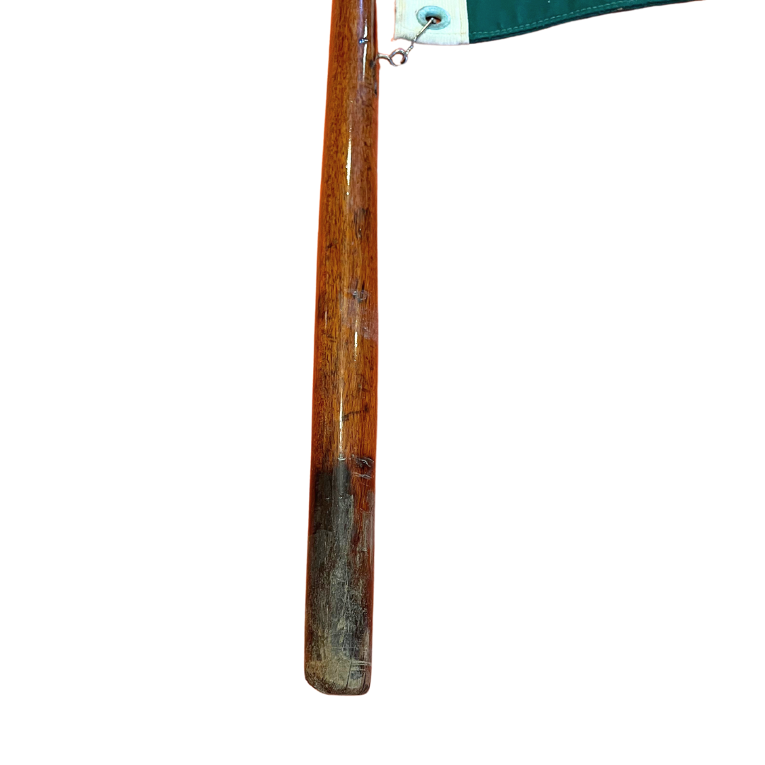 salvaged yacht flag on teak pole