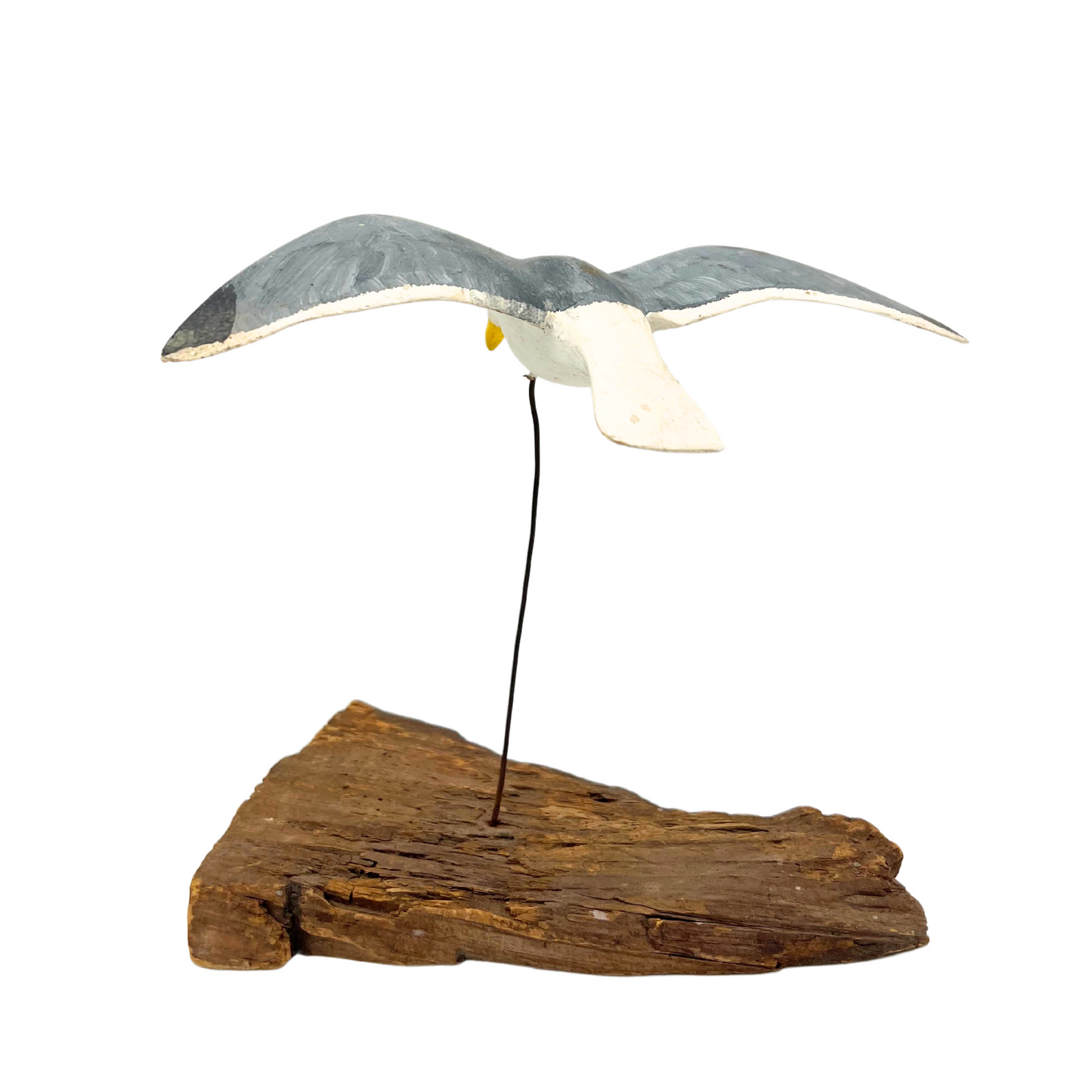 vintage handmade flying seagull over driftwood