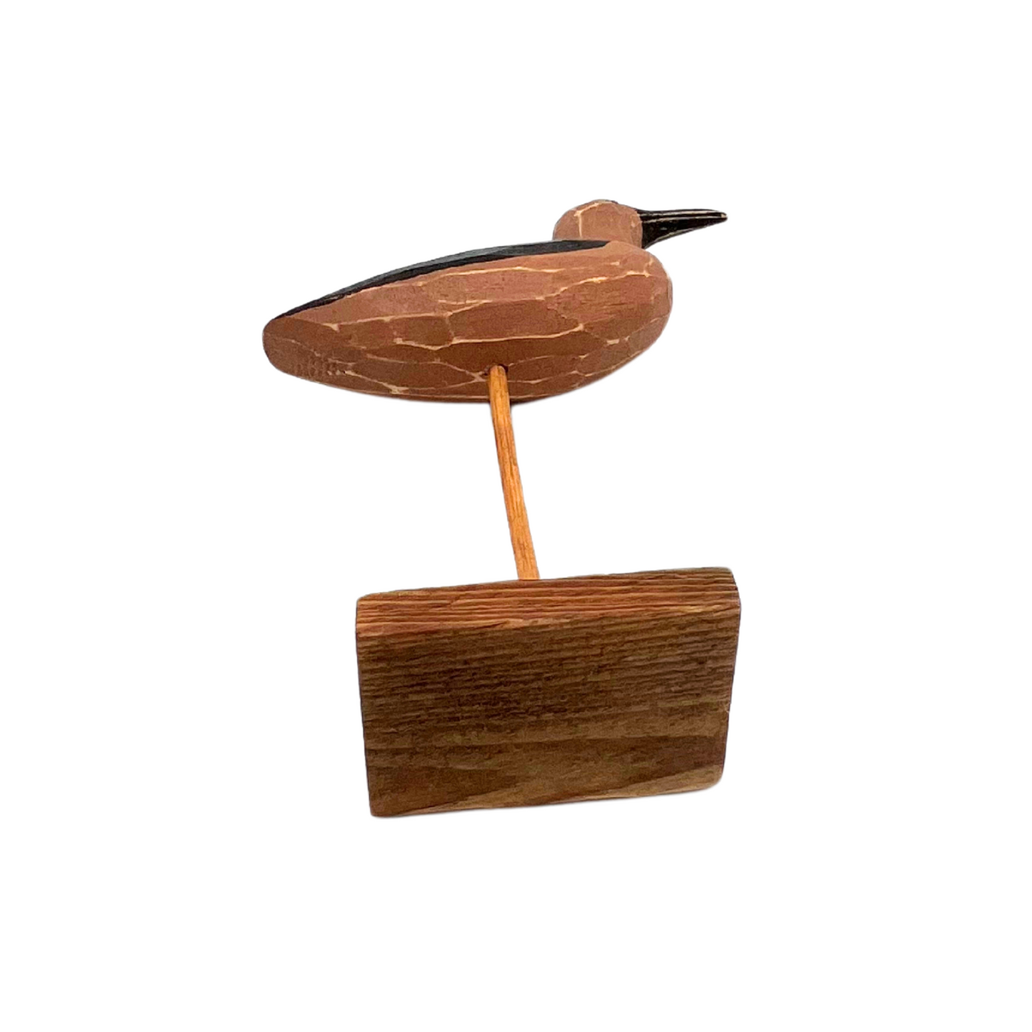 carved wooden shorebird